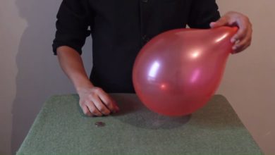 تعلم العاب الخفة # 484 ( ادخال القطعة النقدية داخل البالون للمبتدئين )  magic trick revealed
